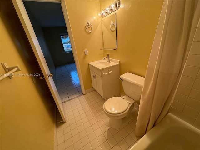 full bathroom with toilet, shower / tub combo with curtain, vanity, and tile patterned floors