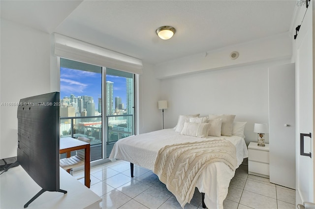 tiled bedroom with access to outside