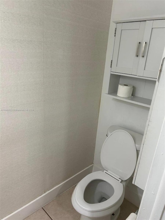 bathroom featuring tile patterned flooring and toilet