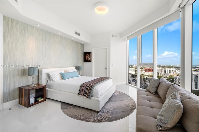 tiled bedroom with access to exterior and multiple windows