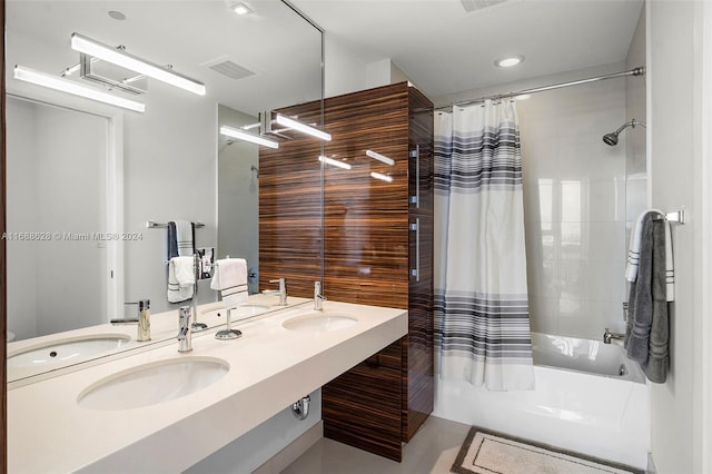 bathroom featuring shower / tub combo with curtain, vanity, and tile patterned floors