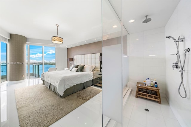 bedroom with light tile patterned floors, a water view, and access to outside