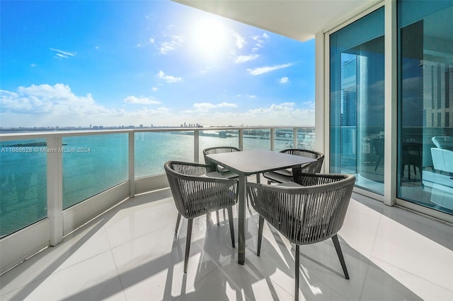 balcony featuring a water view