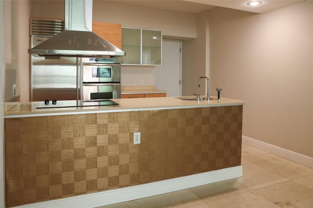 kitchen featuring sink, light tile patterned floors, stainless steel double oven, island exhaust hood, and black electric stovetop