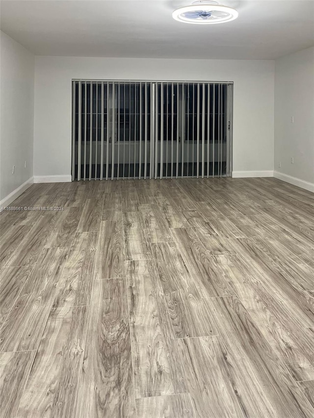 spare room featuring wood-type flooring