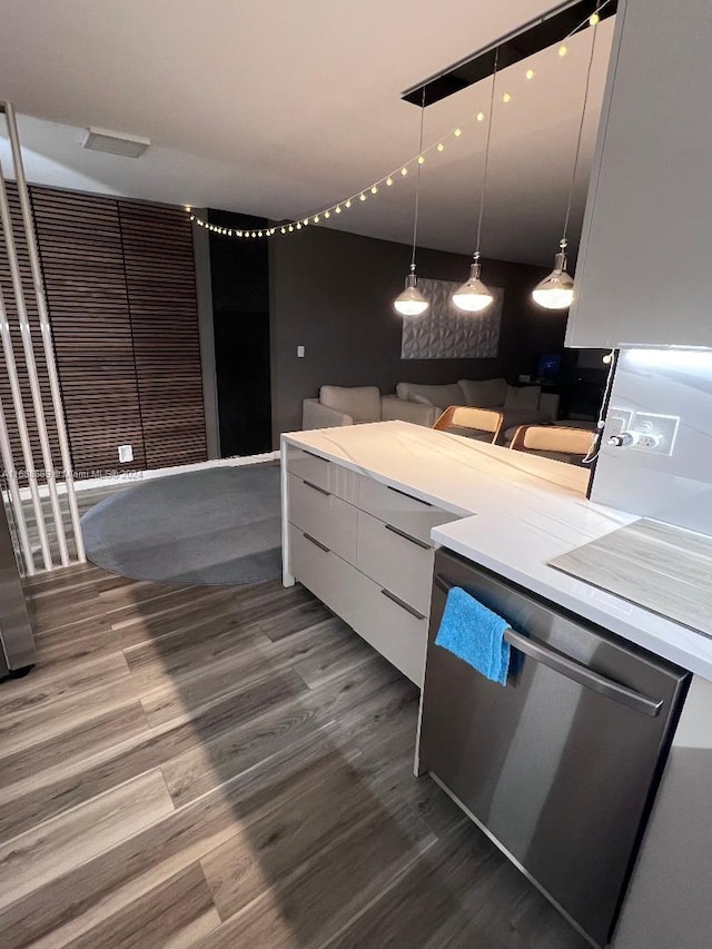 kitchen with dishwasher, pendant lighting, hardwood / wood-style flooring, and white cabinets