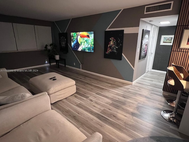 living room with light hardwood / wood-style flooring