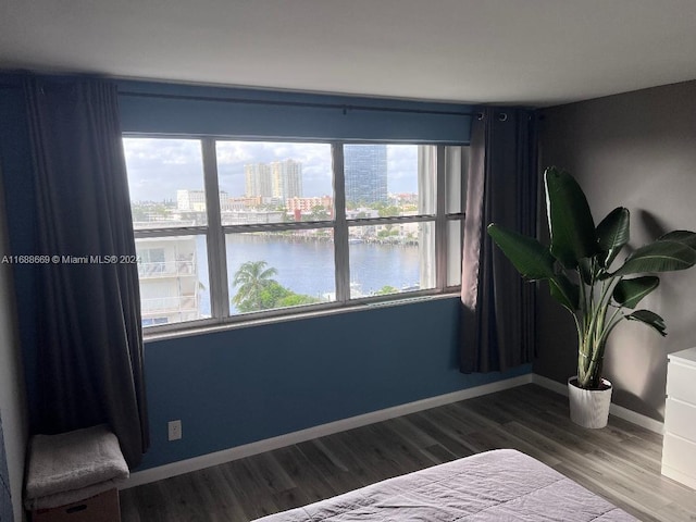 111 Golden Isles Dr Unit G5, Hallandale Beach, FL 33009 - bedroom with wood finished floors, a view of city, and a water view