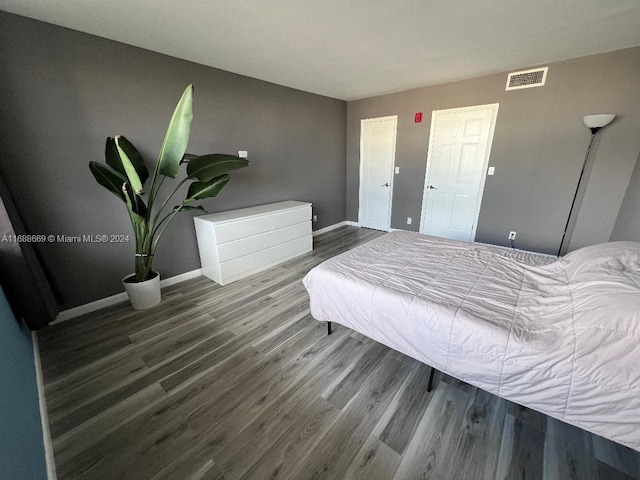 bedroom with hardwood / wood-style flooring