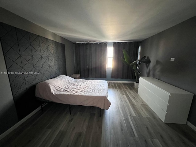 bedroom with wood-type flooring