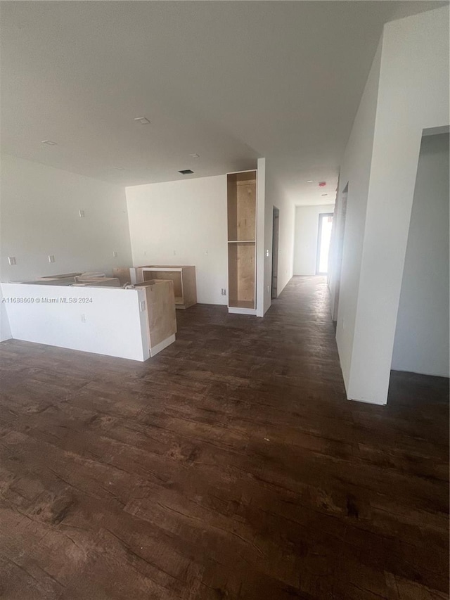 hall with dark hardwood / wood-style flooring