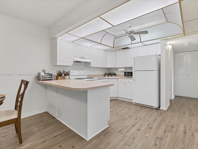 kitchen featuring white cabinets, white appliances, light hardwood / wood-style floors, and kitchen peninsula