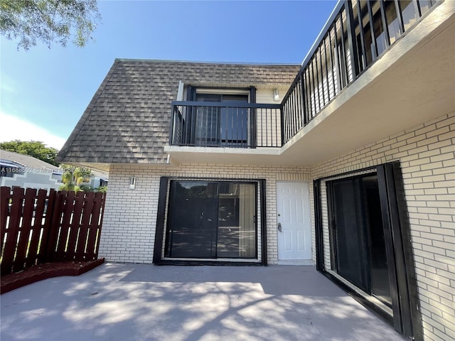 exterior space with a patio area and a balcony