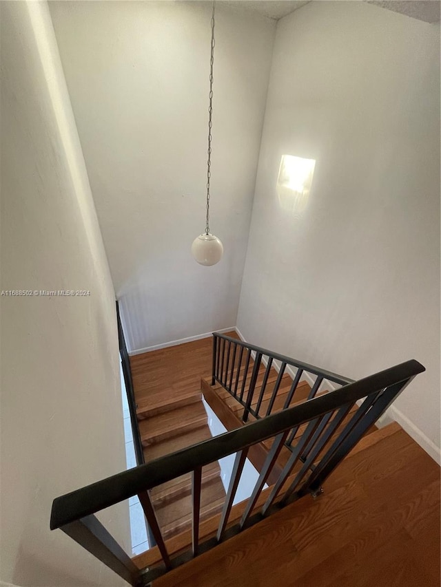 staircase featuring hardwood / wood-style flooring