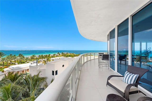 balcony featuring a water view