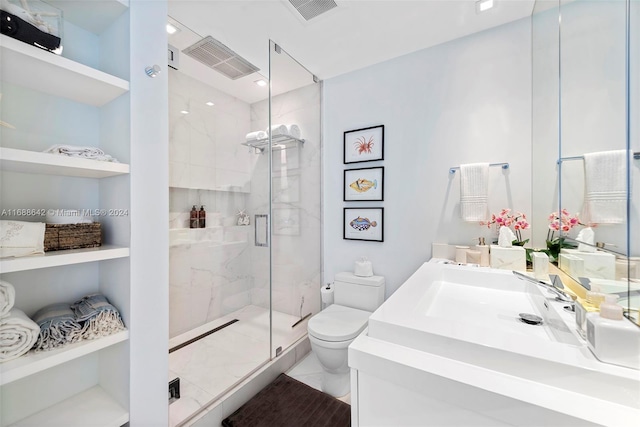 bathroom with toilet, vanity, tile patterned flooring, and walk in shower