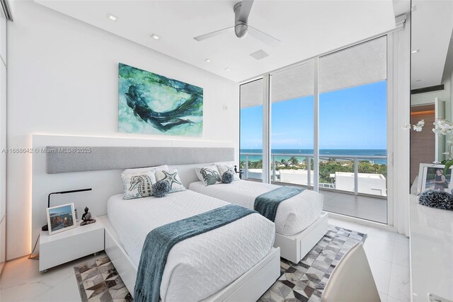 100 S Pointe Dr Unit 706, Miami Beach, FL 33139 - bedroom featuring floor to ceiling windows, a water view, and a ceiling fan