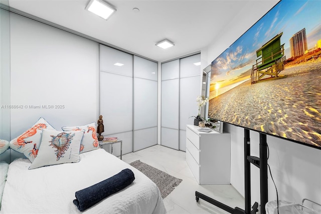 100 S Pointe Dr Unit 706, Miami Beach, FL 33139 - bedroom featuring light marble finish floors