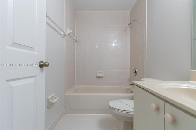 full bathroom with tile patterned flooring, vanity, tiled shower / bath combo, and toilet