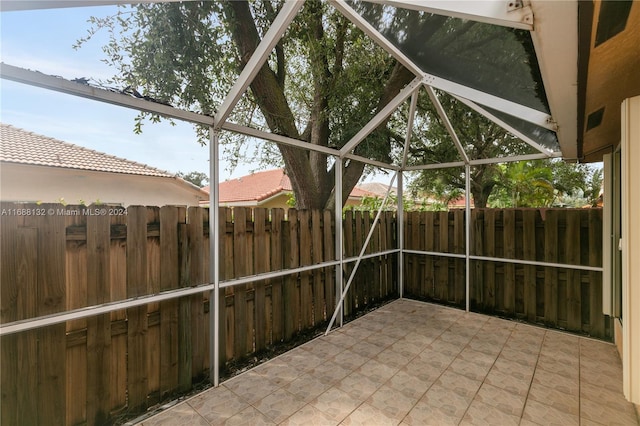 view of patio / terrace featuring a lanai