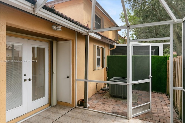 unfurnished sunroom featuring french doors