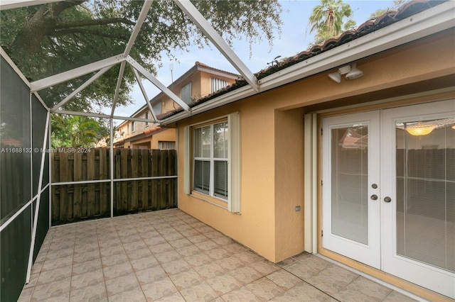 view of patio / terrace with a lanai and french doors