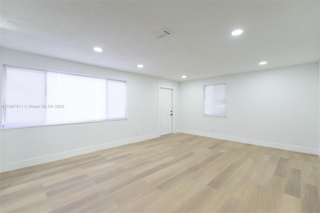 spare room featuring light hardwood / wood-style flooring