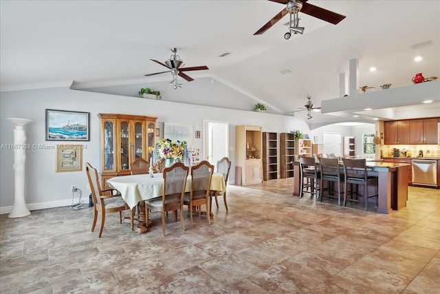 dining room featuring high vaulted ceiling