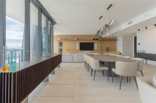 dining room with floor to ceiling windows