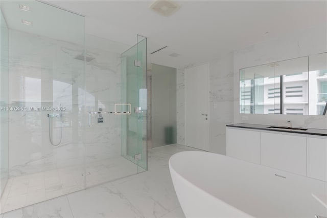 1000 Biscayne Blvd Unit 2702, Miami, FL 33132 - full bathroom featuring marble finish flooring, a freestanding bath, a marble finish shower, and vanity