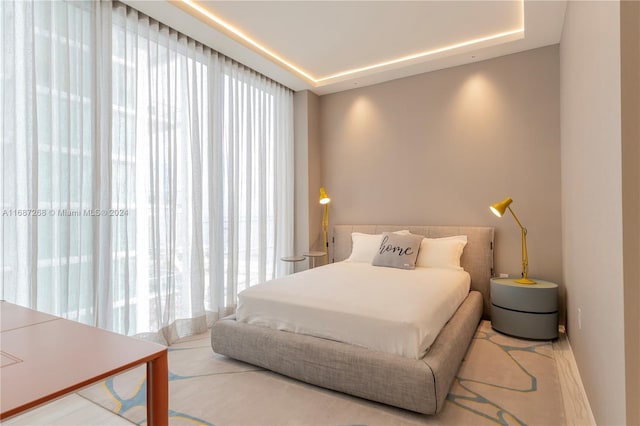 bedroom featuring a tray ceiling