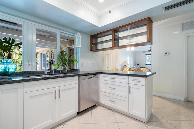 kitchen with dishwasher, kitchen peninsula, sink, and white cabinets