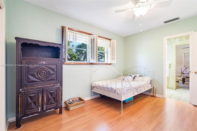 bedroom featuring hardwood / wood-style flooring and ceiling fan