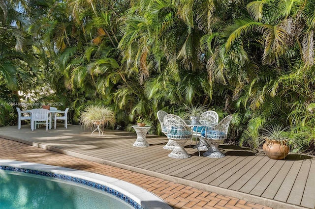 view of swimming pool featuring a deck