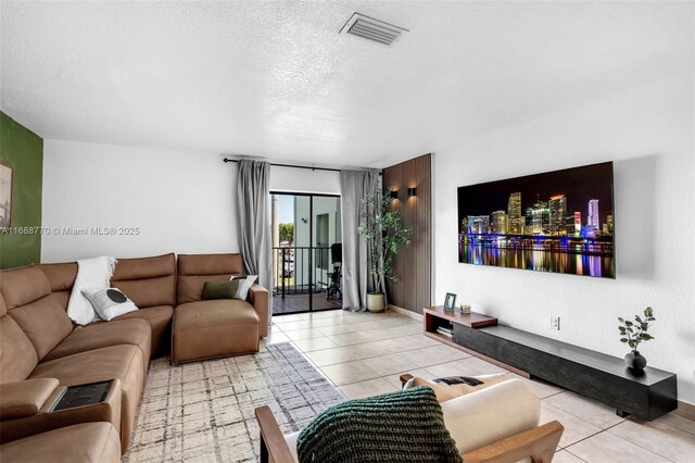 kitchen with light tile patterned floors, backsplash, and appliances with stainless steel finishes