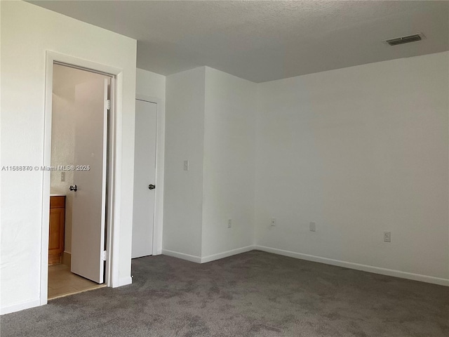 unfurnished bedroom featuring carpet