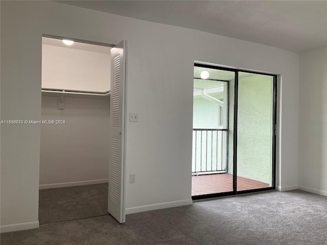 unfurnished bedroom with carpet floors and a closet