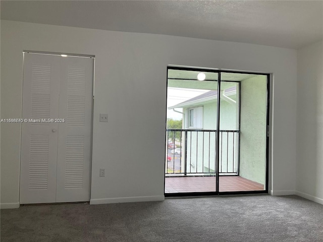 spare room featuring carpet flooring