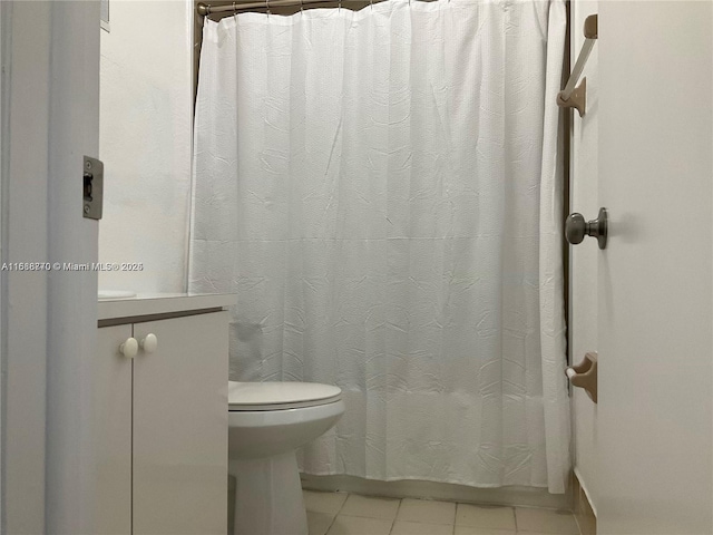 bathroom featuring tile patterned floors and toilet