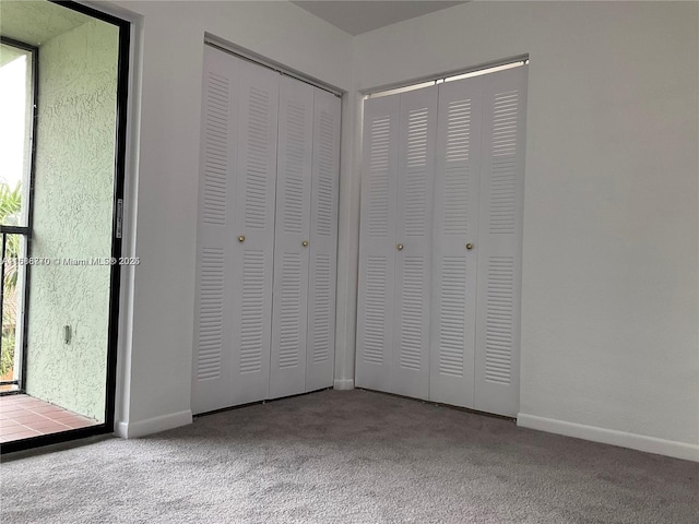 unfurnished bedroom featuring light colored carpet