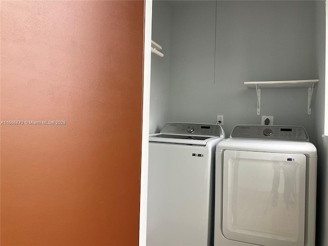 clothes washing area featuring independent washer and dryer