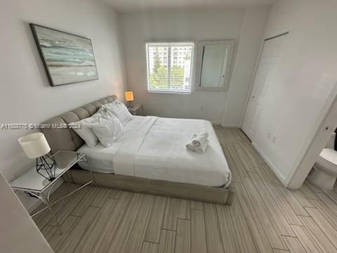 bedroom with light hardwood / wood-style floors