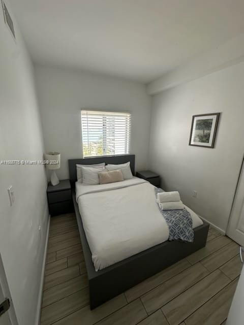 bedroom with light hardwood / wood-style flooring