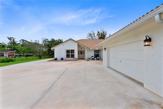 view of side of property with a garage