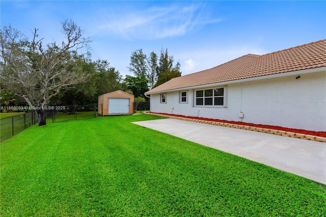 2940 SW 155th Ln, Davie, FL 33331 - view of yard with a garage, an outdoor structure, and a patio