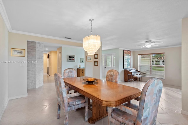 dining space featuring crown molding, light tile patterned floors, and ceiling fan with notable chandelier