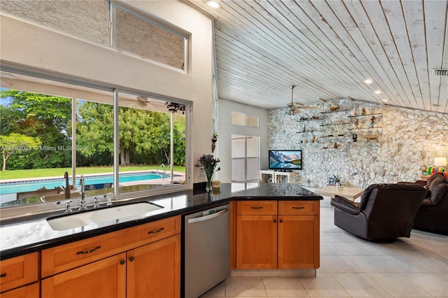 kitchen featuring wood ceiling, vaulted ceiling, sink, light tile patterned floors, and dishwasher