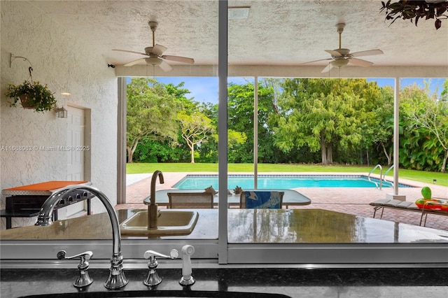 2940 SW 155th Ln, Davie, FL 33331 - outdoor pool with ceiling fan, view of wooded area, and a yard