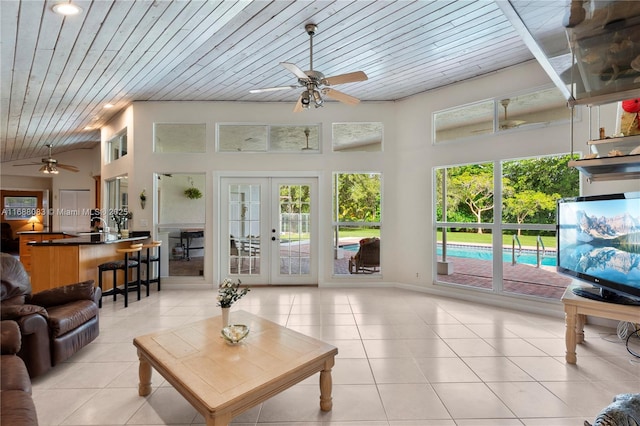 2940 SW 155th Ln, Davie, FL 33331 - living room featuring ceiling fan, wood ceiling, light tile patterned floors, french doors, and vaulted ceiling