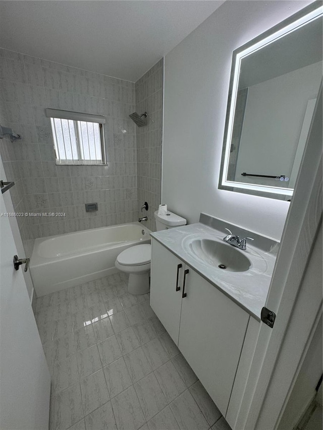 full bathroom featuring vanity, toilet, and tiled shower / bath combo